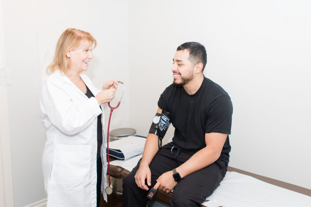 doctor examining patient